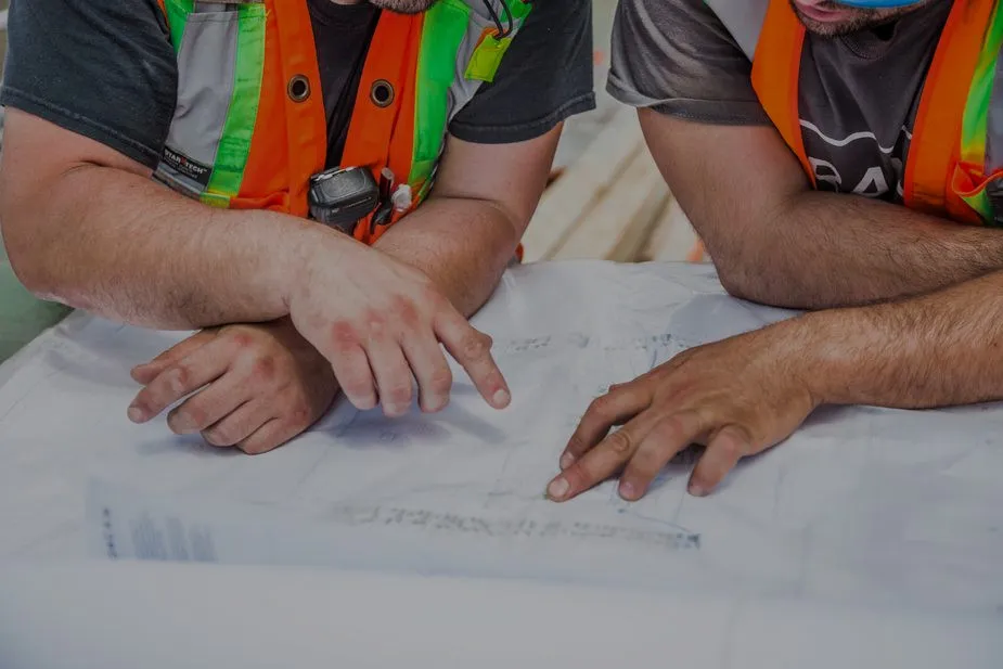 Industrial blueprints and hands-on bolting work